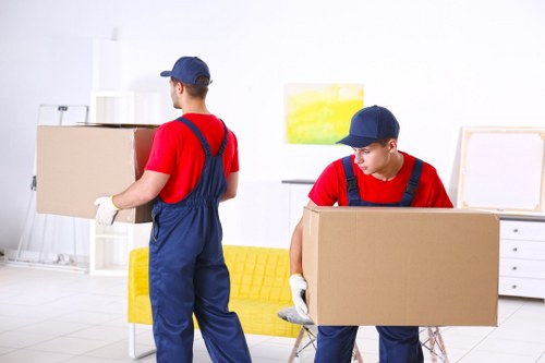 Same day removals team preparing a van for a quick move in Queens Park