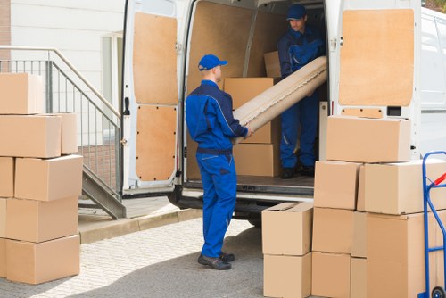 Removalists loading household furniture in Queens Park