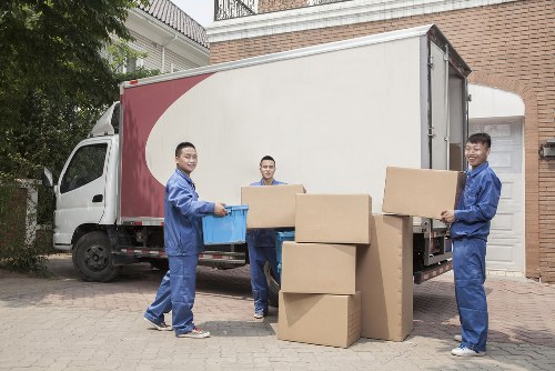 Stacked moving boxes and packing supplies in Queenspark