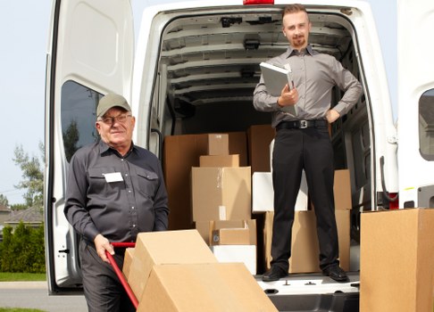 Mover assessing cubic-yard space for a Queens Park apartment move