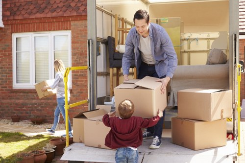 Moving boxes and furniture prepared for relocation with professional support