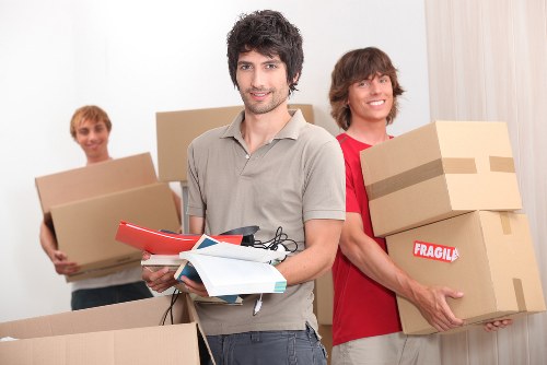 House movers carrying furniture during a Queenspark move