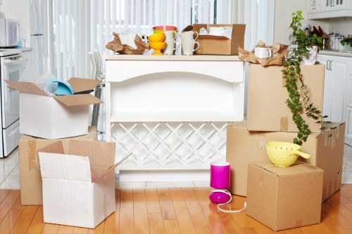 A moving team handling boxes during a booked removal