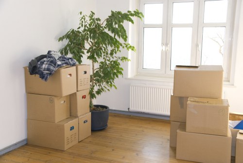 Professional movers handling office furniture during commercial moves in Queenspark