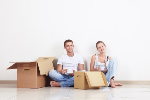Relocation team placing furniture into a new home interior