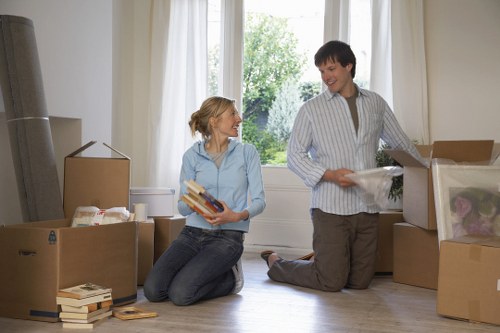 Removal team separating furniture parts and reusable materials for recycling