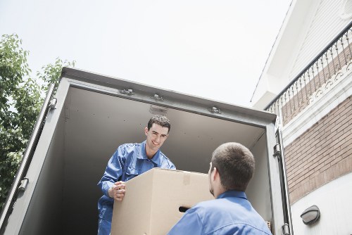 Local house removalists in Queenspark unloading furniture at a new home