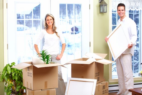 House removals team handling furniture during a Queenspark move