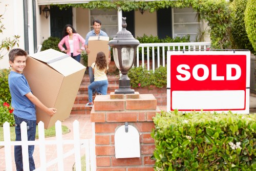 Student removals service handling boxes, desk, and mattress in Queens Park